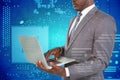 Composite image of midsection of businessman using laptop Royalty Free Stock Photo