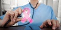 Composite image of midsection of female doctor examining mobile phone with stethoscope Royalty Free Stock Photo