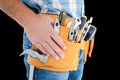 Composite image of midsection of handyman wearing tool belt Royalty Free Stock Photo