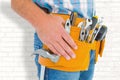 Composite image of midsection of handyman wearing tool belt Royalty Free Stock Photo