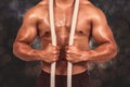 Composite image of muscular man with battle rope Royalty Free Stock Photo