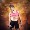 Composite image of muscular woman lifting heavy dumbbell Royalty Free Stock Photo