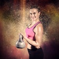 Composite image of muscular woman lifting heavy kettlebell Royalty Free Stock Photo