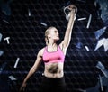 Composite image of muscular woman lifting heavy kettlebell Royalty Free Stock Photo