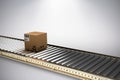 Composite image of packed cardboard box on conveyor belt Royalty Free Stock Photo