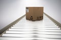 Composite image of packed parcel box on conveyor belt Royalty Free Stock Photo