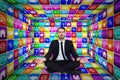 Composite image of peaceful businessman sitting in lotus pose relaxing