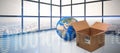 Composite image of planet earth and brown cardboard box Royalty Free Stock Photo