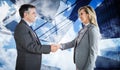 Composite image of pleased businessman shaking the hand of content businesswoman Royalty Free Stock Photo