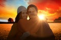 Composite image of portarit of happy couple holding paper heart