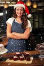 Composite image of portrait of barista wearing santa hat Royalty Free Stock Photo