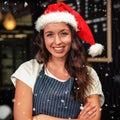 Composite image of portrait of barista wearing santa hat Royalty Free Stock Photo