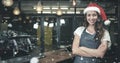 Composite image of portrait of barista wearing santa hat Royalty Free Stock Photo