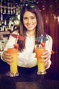 Composite image of portrait of bartender serving cocktail at bar counter Royalty Free Stock Photo