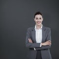 Composite image of portrait of beautiful businesswoman standing arms crossed Royalty Free Stock Photo