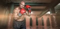 Composite image of portrait of boxer with red gloves