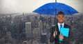 Composite image of portrait of businessman holding blue umbrella and file Royalty Free Stock Photo