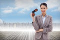 Composite image of portrait of a businesswoman holding binoculars Royalty Free Stock Photo