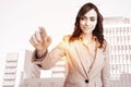 Composite image of portrait of businesswoman touching invisible screen Royalty Free Stock Photo