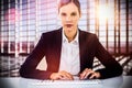 Composite image of portrait of businesswoman typing on keyboard at desk Royalty Free Stock Photo