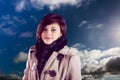 Composite image of portrait of caucasian woman smiling against clouds in the blue sky Royalty Free Stock Photo