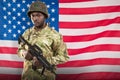 Composite image of portrait of confident soldier holding rifle Royalty Free Stock Photo