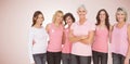 Composite image of portrait of confident women supporting breast cancer awareness Royalty Free Stock Photo