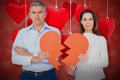 Composite image of portrait of couple holding broken heart shape paper 3d Royalty Free Stock Photo