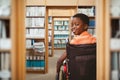 Composite image of portrait of cute boy sitting in wheelchair Royalty Free Stock Photo