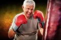 Composite image of portrait of a determined senior boxer Royalty Free Stock Photo