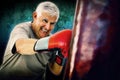 Composite image of portrait of a determined senior boxer Royalty Free Stock Photo