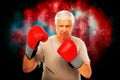 Composite image of portrait of a determined senior boxer Royalty Free Stock Photo