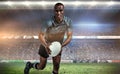 Composite image of portrait of determined sportsman running with rugby ball