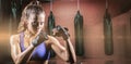Composite image of portrait of female confident boxer with fighting stance Royalty Free Stock Photo