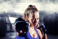 Composite image of portrait of female fighter punching Royalty Free Stock Photo