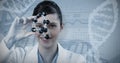 Composite image of portrait of female scientist holding molecular model Royalty Free Stock Photo