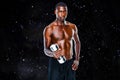 Composite image of portrait of a fit shirtless young man lifting dumbbell Royalty Free Stock Photo