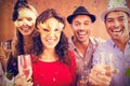 Composite image of portrait of friends holding champagne glasses while laughing