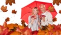 Composite image of portrait of happy couple under red umbrella Royalty Free Stock Photo