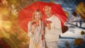 Composite image of portrait of happy couple under red umbrella Royalty Free Stock Photo