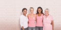 Composite image of portrait of happy women supporting breast cancer social issue Royalty Free Stock Photo