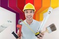 Composite image of portrait of happy worker holding various equipment Royalty Free Stock Photo