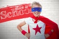 Composite image of portrait image of cheerful superhero boy Royalty Free Stock Photo