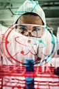 Composite image of portrait of a protected science student dropping liquid in a test tube Royalty Free Stock Photo