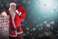 Composite image of portrait of santa claus carrying bag full of gifts by chimney Royalty Free Stock Photo