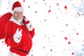 Composite image of portrait of santa claus pointing while carrying christmas bag Royalty Free Stock Photo