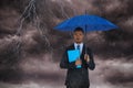 Composite image of portrait of serious businessman holding blue umbrella and file Royalty Free Stock Photo