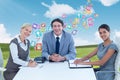 Composite image of portrait of smiling business people sitting at conference table Royalty Free Stock Photo