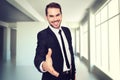 Composite image of portrait of smiling businessman offering handshake Royalty Free Stock Photo