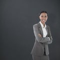 Composite image of portrait of smiling businesswoman standing arms crossed Royalty Free Stock Photo